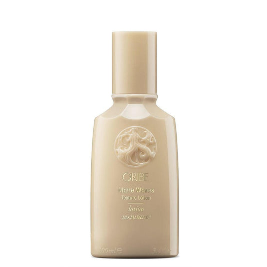 Oribe Matte Waves Texture Lotion bottle for effortlessly tousled waves with a matte finish and nourishing hold, perfect for all hair types