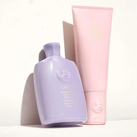 Oribe Serene Scalp Oil Control Shampoo and Conditioner set on a white background.